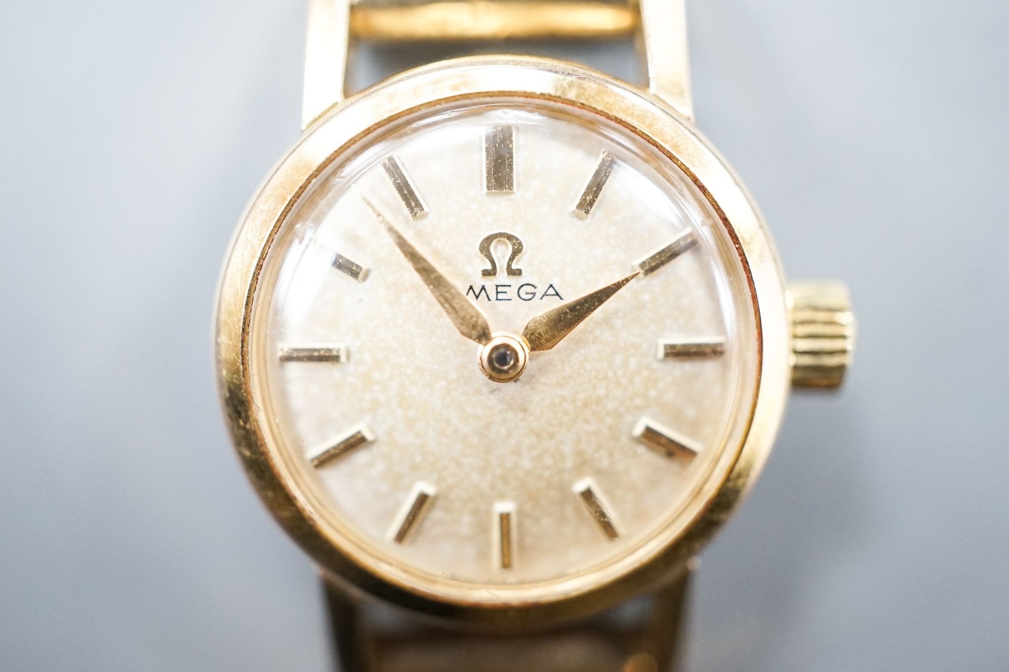 A lady's 1960's steel and gold plated Omega manual wind wrist watch, on an associated 9ct gold bracelet